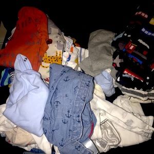 About 40 onesies and 7 sleepers for boys